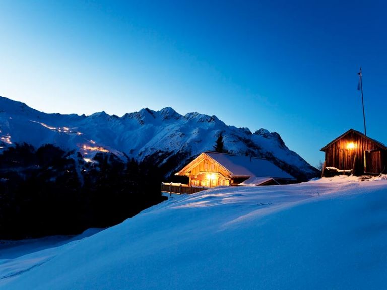 Winter landscape in Sölden at dusk with a hut with lights on!